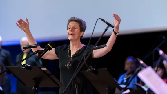 Ms Kinga Marjatta Pap from the Evangelical Lutheran Church in Hungary is leading the Assembly choir. Photo: LWF/Albin Hillert
